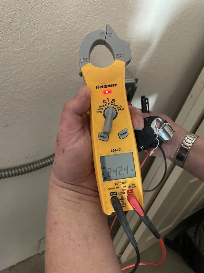 Voltage testing with clamp meter during Hot Tub / Pool Electrical Wiring in Oelwein